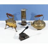 A brass iron and stand, brass kettle, Davy lamp and an embosser stamp (13 High St Hawick)