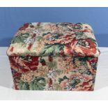 An upholstered storage box/stool