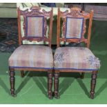 A pair of dining chairs in need of re-upholstery