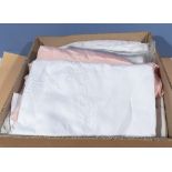 A box containing vintage linen