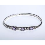 A silver bangle set with amethysts, 12gms