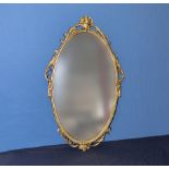 An oval gilt framed mirror 66cm x 40cm