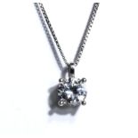 A silver CZ pendant and chain