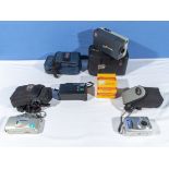 A Kodak cine camera, 2 Olympus and one Canon camera