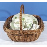 A basket containing a decorative part tea set