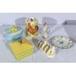 A collection of pottery table ware, butter dish, toast rack, jam pot and others