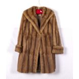 A lady's three quarter length fur coat
