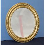 An oval gilt framed mirror 55cm x 48cm