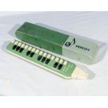 A vintage Hohner Soprano melodica with box