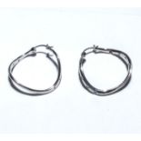 A pair of silver earrings