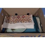 A box containing vintage fabrics