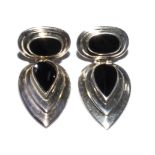 A pair of silver earrings