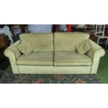 A pale green cord three seater sofa, matching lot 97