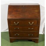 A 1950's mahogany bureau