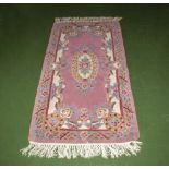 A pink Chinese style rug