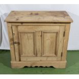 A small pine kitchen cabinet.