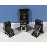 Three vintage Kodak cameras