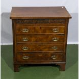 A 20th century walnut chest of four drawers, 64cm x 42cm and 68cm tall