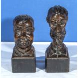 Two carved wooden busts 18 and 20cm tall