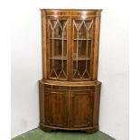 A reproduction corner cabinet.