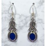 A pair of silver dropper earrings set with blue stones