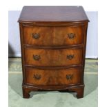 A reproduction bow front mahogany chest. 54cm x 40cm