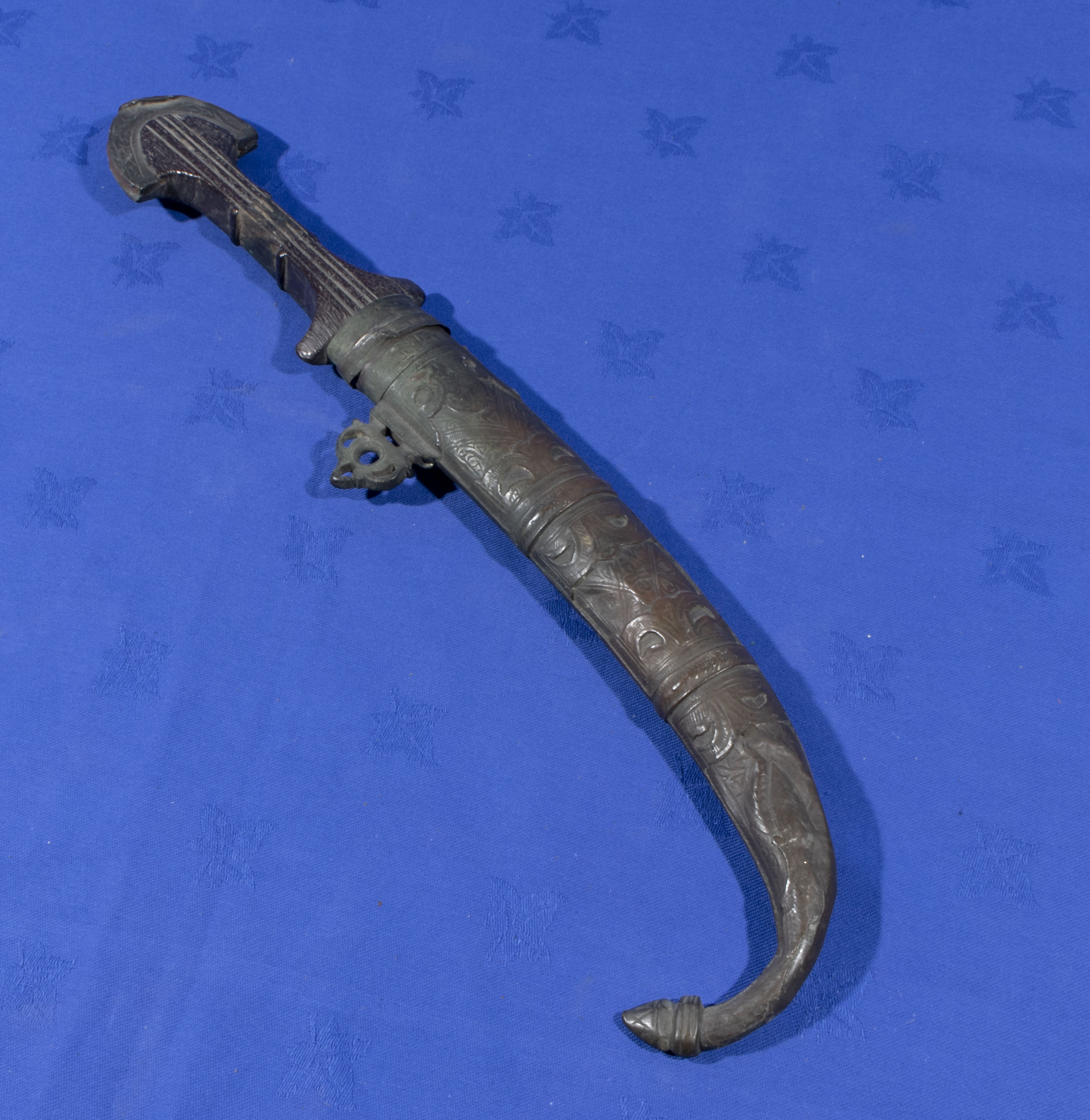 A Middle Eastern brass dagger and scabbard