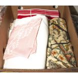 A box containing vintage linen and fabric