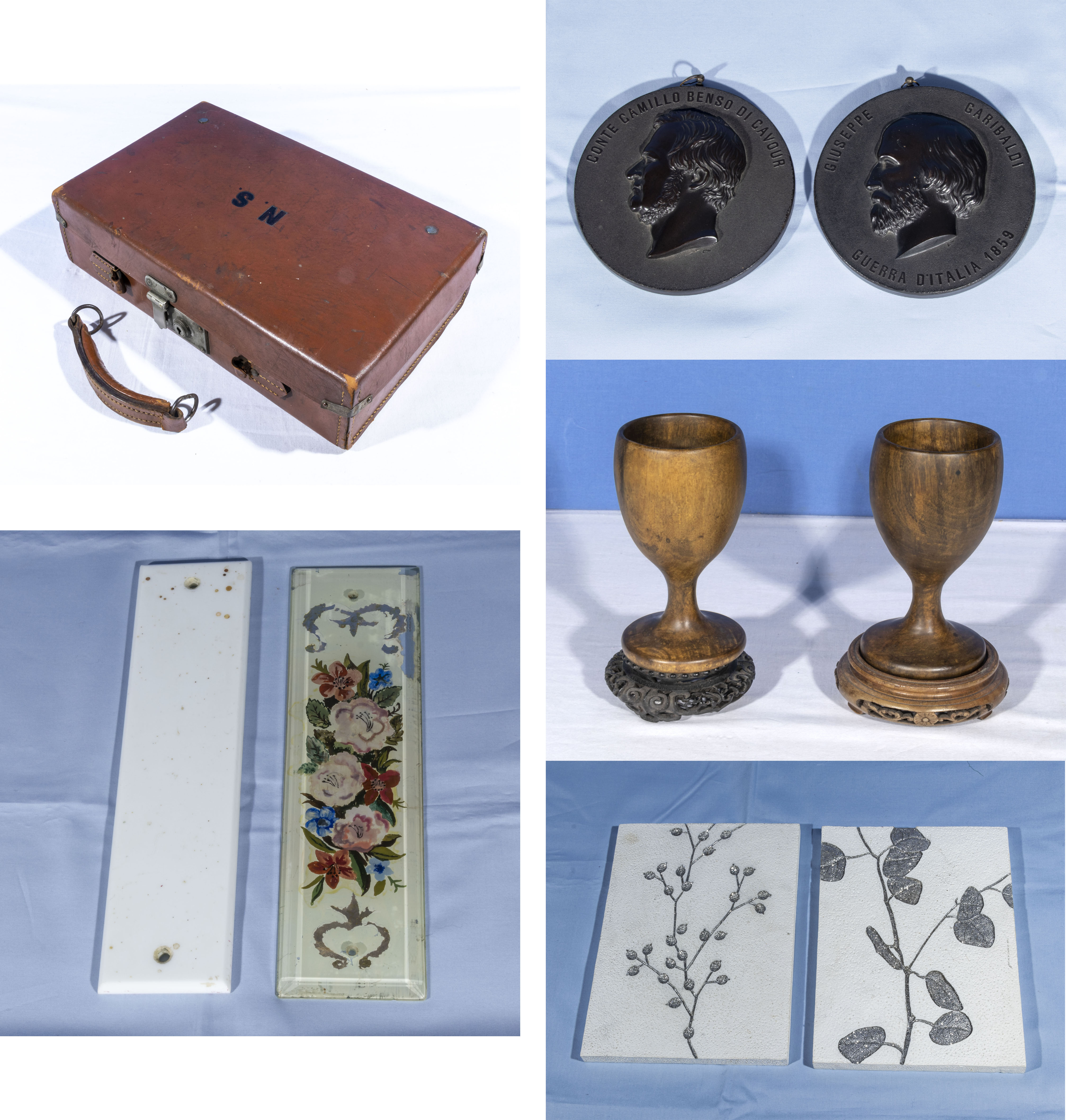 A small leather case, two wood goblets and stands, a pair of medallions, finger plates and tiles