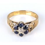 A lady's 9ct gold ring set with sapphires and a diamond, size Q