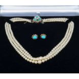 A three strand pearl necklace with turquoise and pearl clasp together with a pair of turquoise