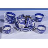 Blue and white transfer printed cups and saucers