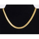 A gold metal necklace
