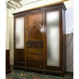 An Edwardian mahogany triple door wardrobe. 182cm wide x 50cm deep x 210cm tall