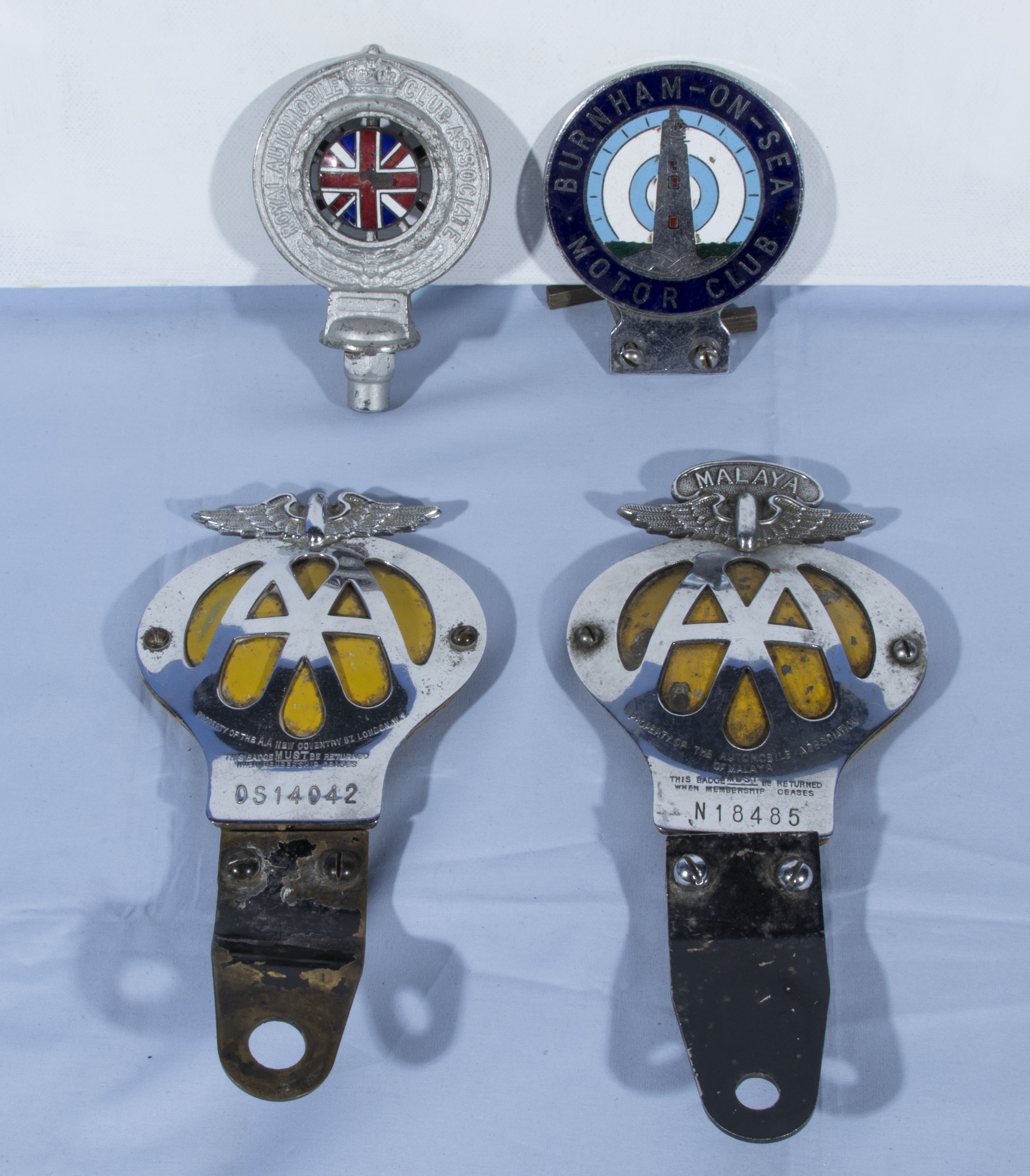 Four automobile car club badges