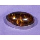 An amber pendant/brooch set in silver mount 4cm