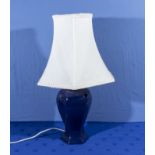 A ceramic table lamp and shade, base 30cm tall