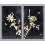 A pair of Chinese panels decorated with ivory flowers