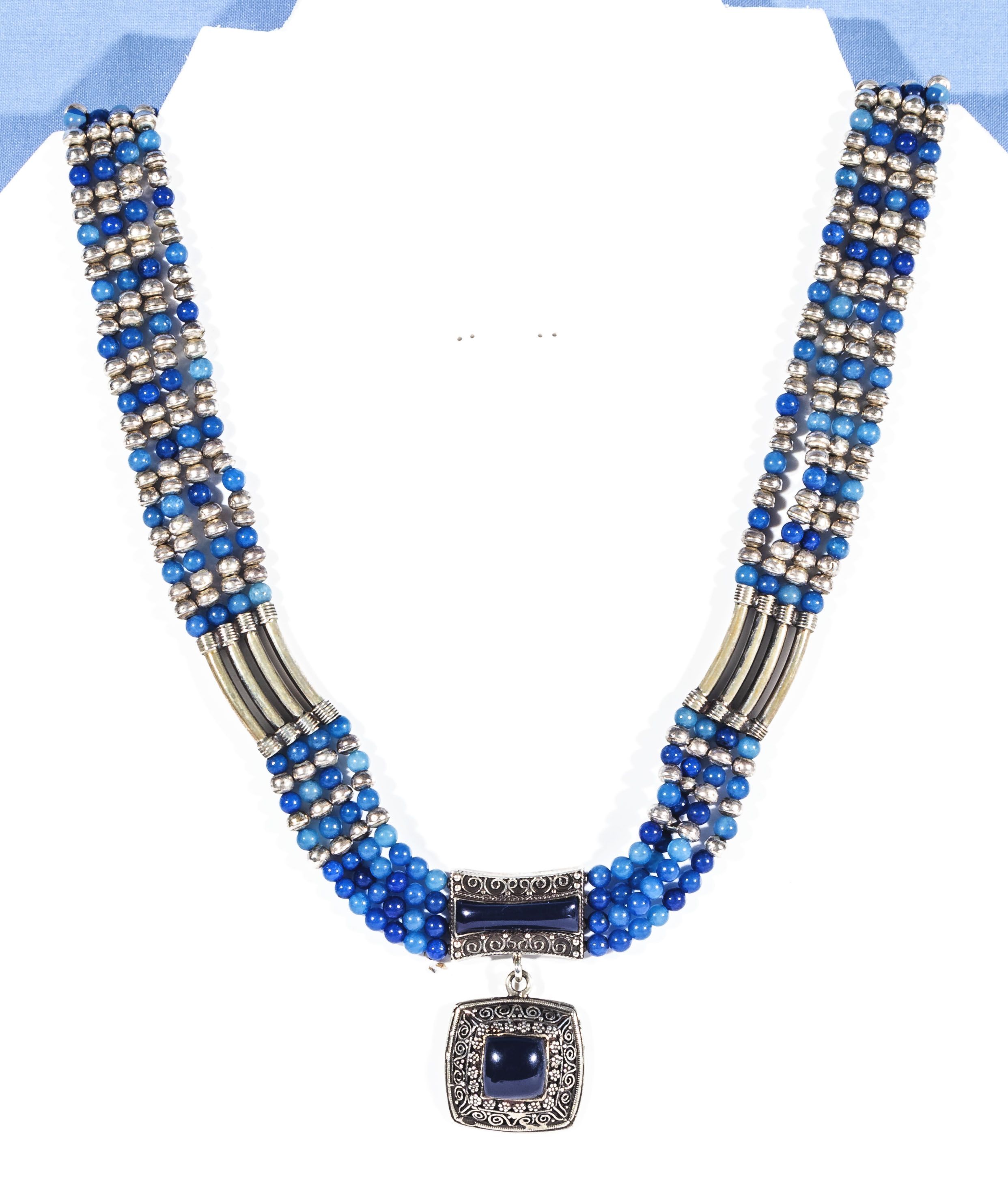 A lapis lazuli and white metal beaded necklace