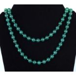 A strand of jadeite stone beads, 94cm long