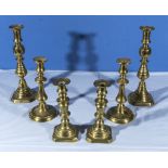 Three pairs of brass candlesticks