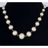 A necklace of large graduated synthetic pearls