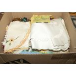 A box containing vintage table linen