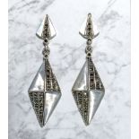 A pair of silver earrings