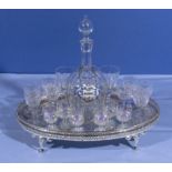 A selection of crystal port and sherry glasses together with a decanter and tray