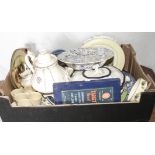 A box containing pottery and cutlery