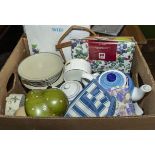 A box containing assorted pottery items