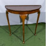 A mahogany demi lune side table