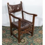 An oak and leather armchair