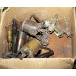 A box containing vintage blow lamps and other metal items